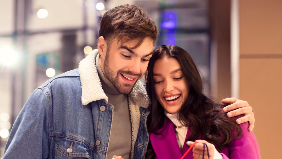 couple looking at shopping bags