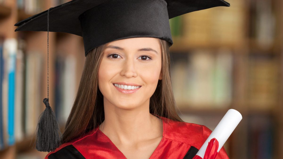 graduate holding degree