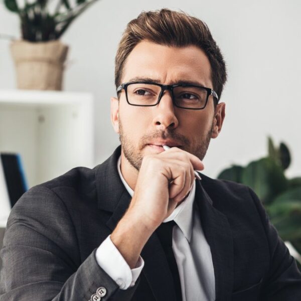 man glasses desk sitting