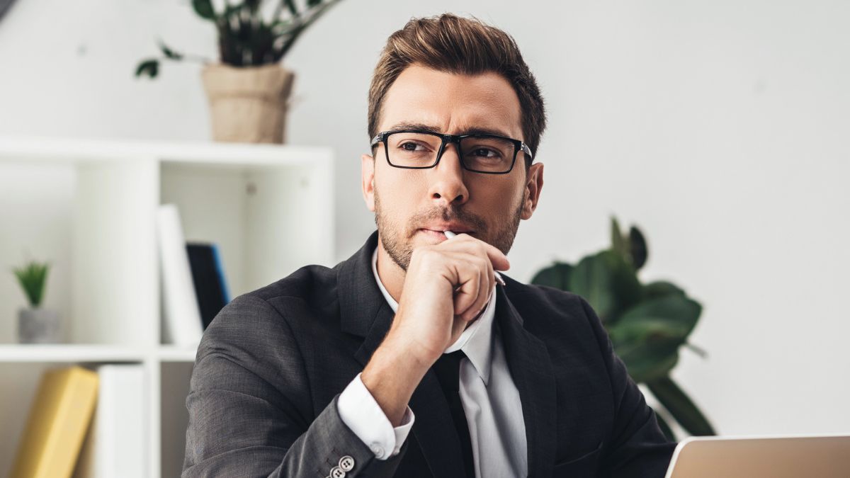 man glasses desk sitting