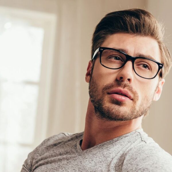 man glasses reading newspaper