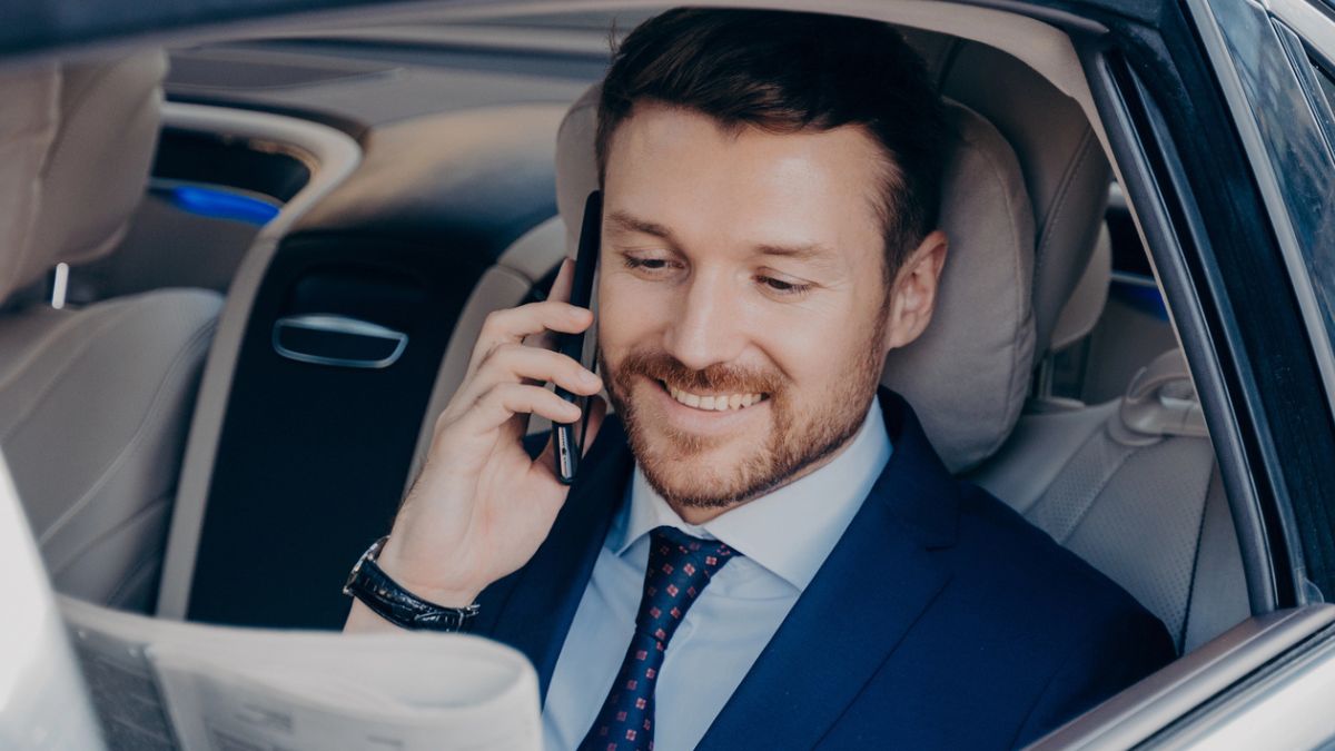man sitting in the back of a car