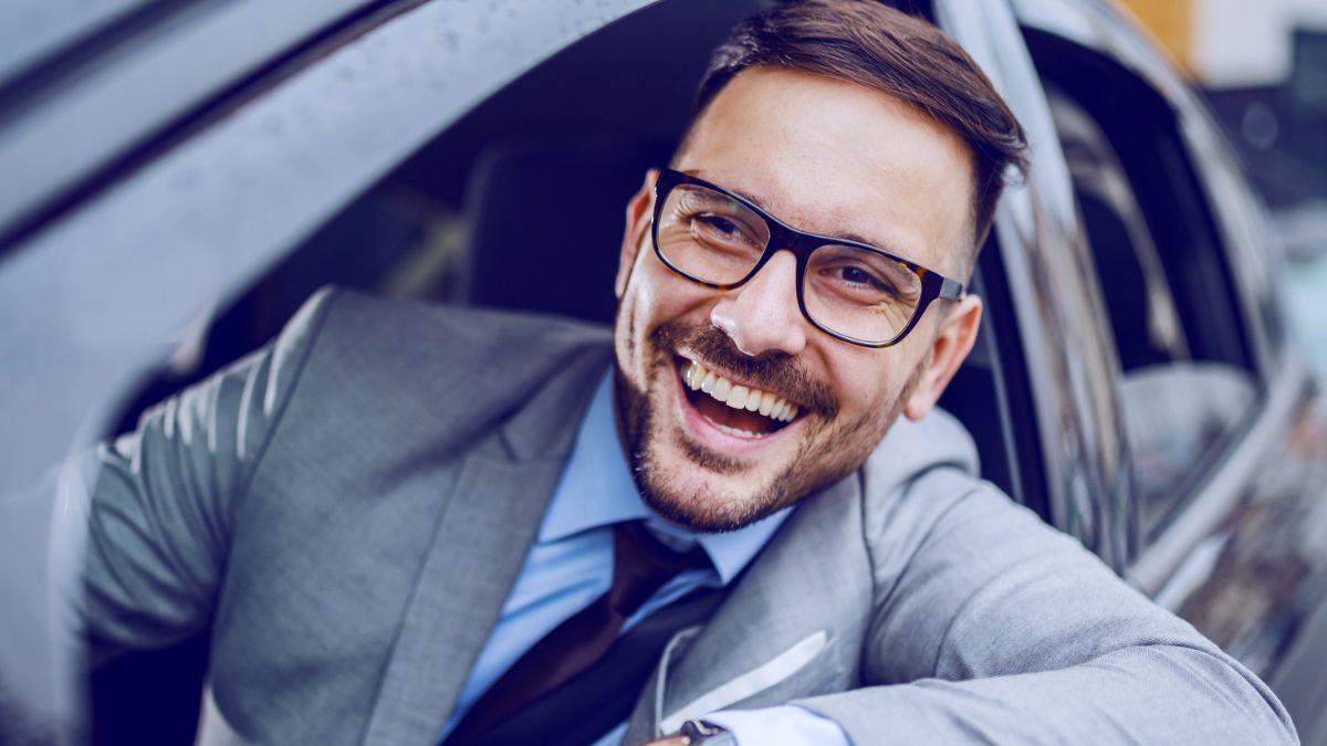 man sitting outside his window