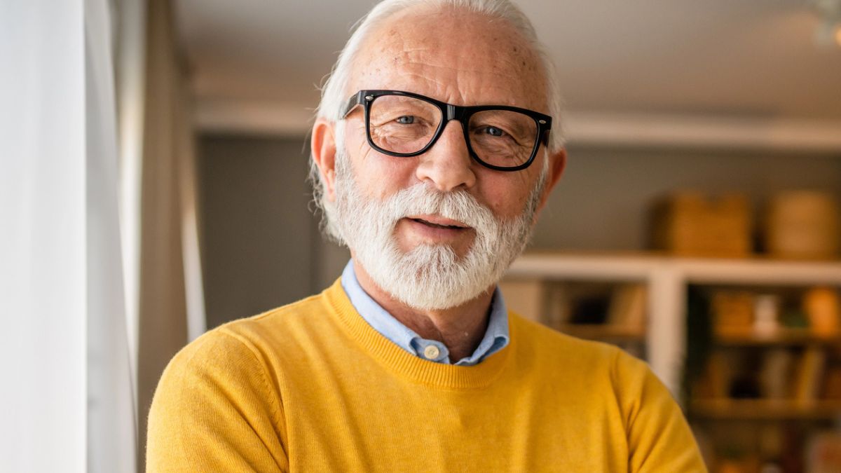 mature man wearing yellow shhirt
