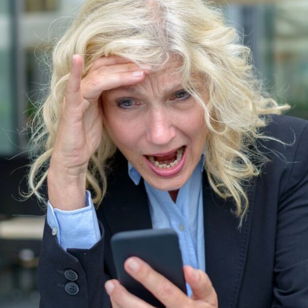 mature woman screaming at phone
