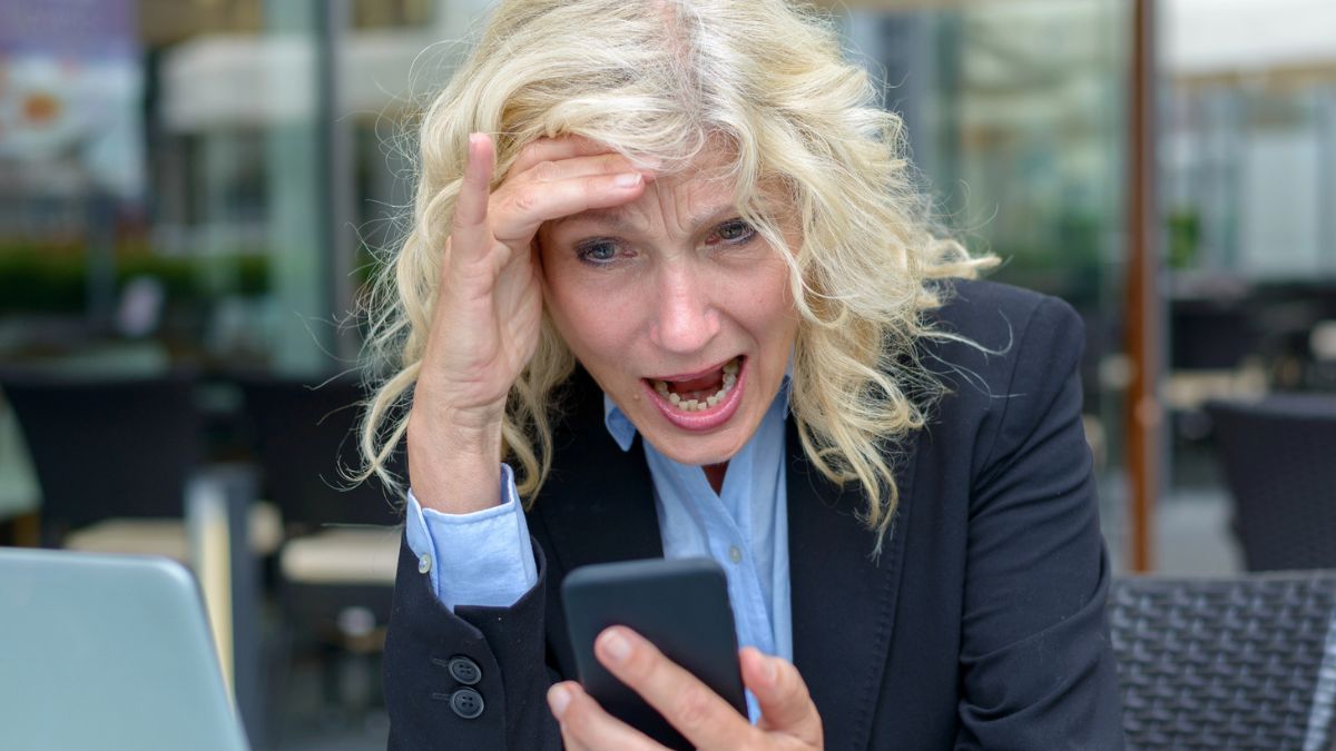 mature woman screaming at phone