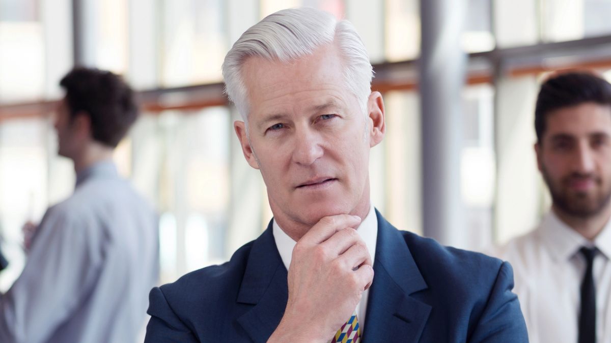senior man in a suit