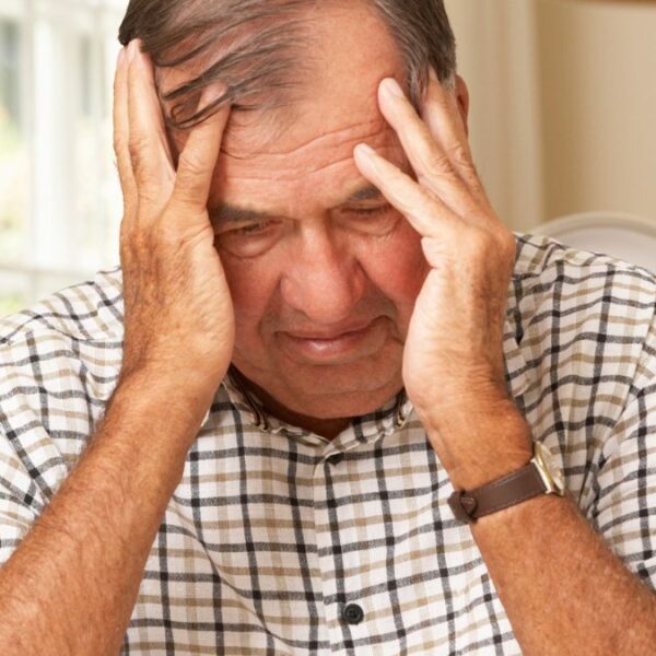 senior man worried at home