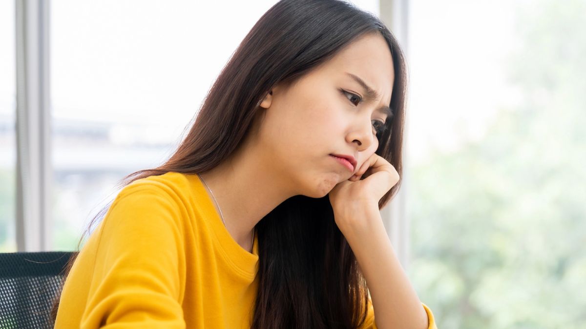woman at a desk sad