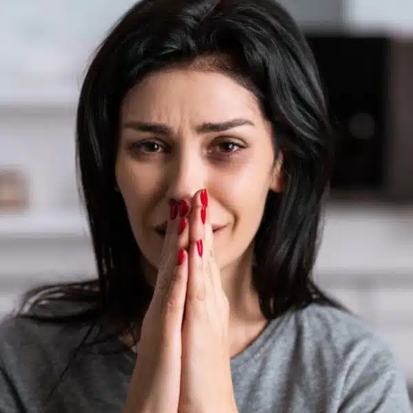 woman covering up her mouth