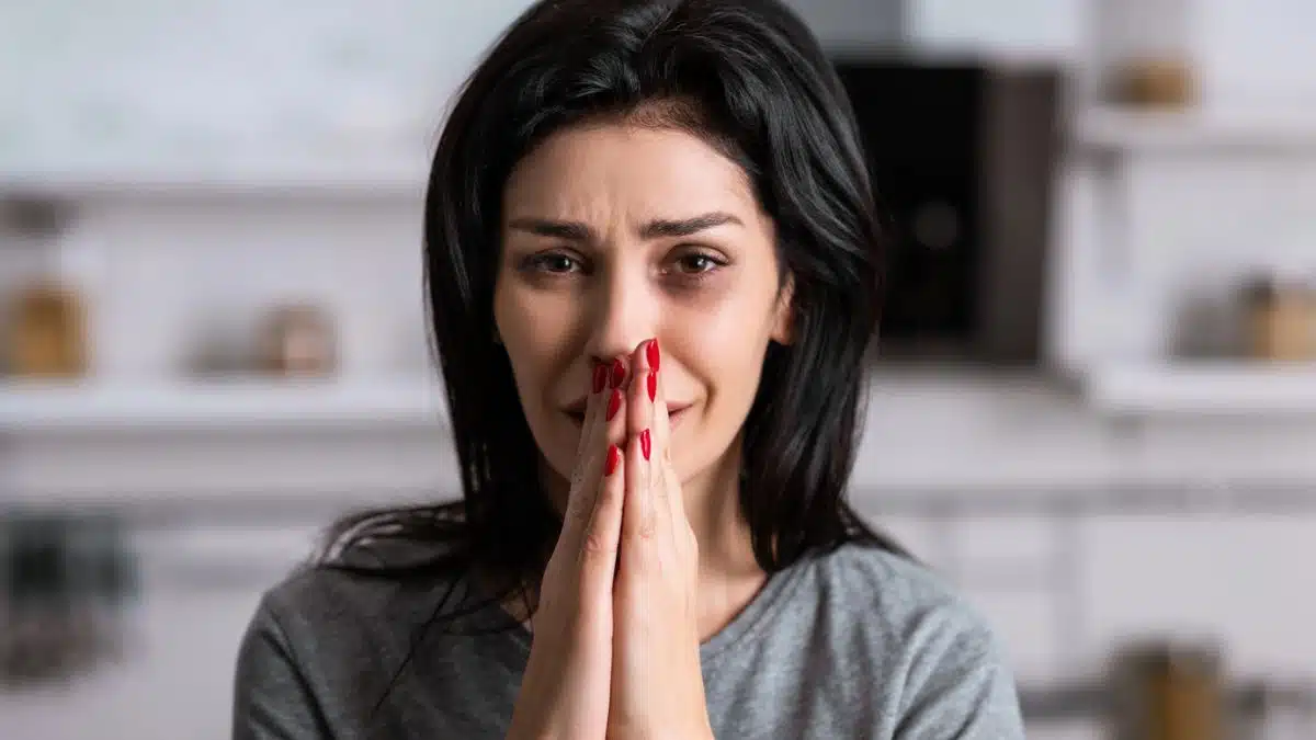 woman covering up her mouth
