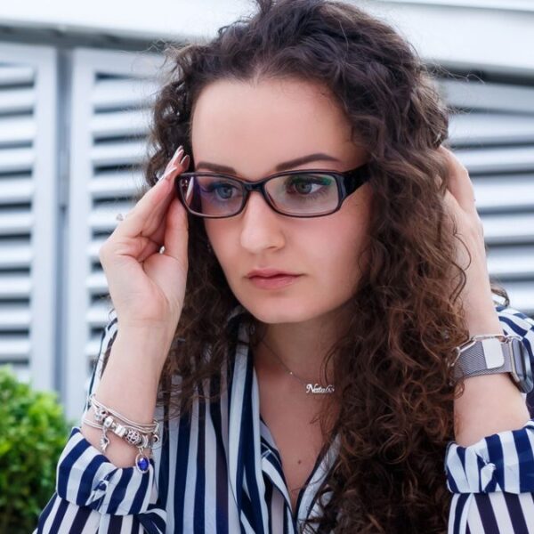 woman curly glasses