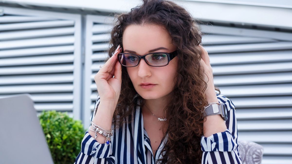 woman curly glasses