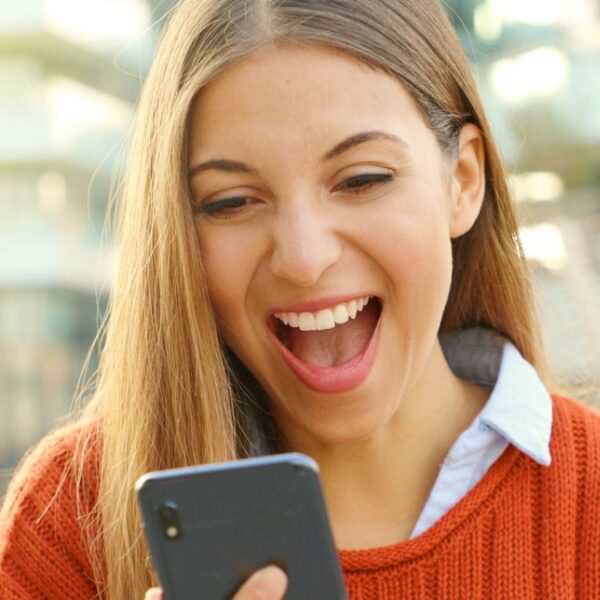 woman excited over a phone