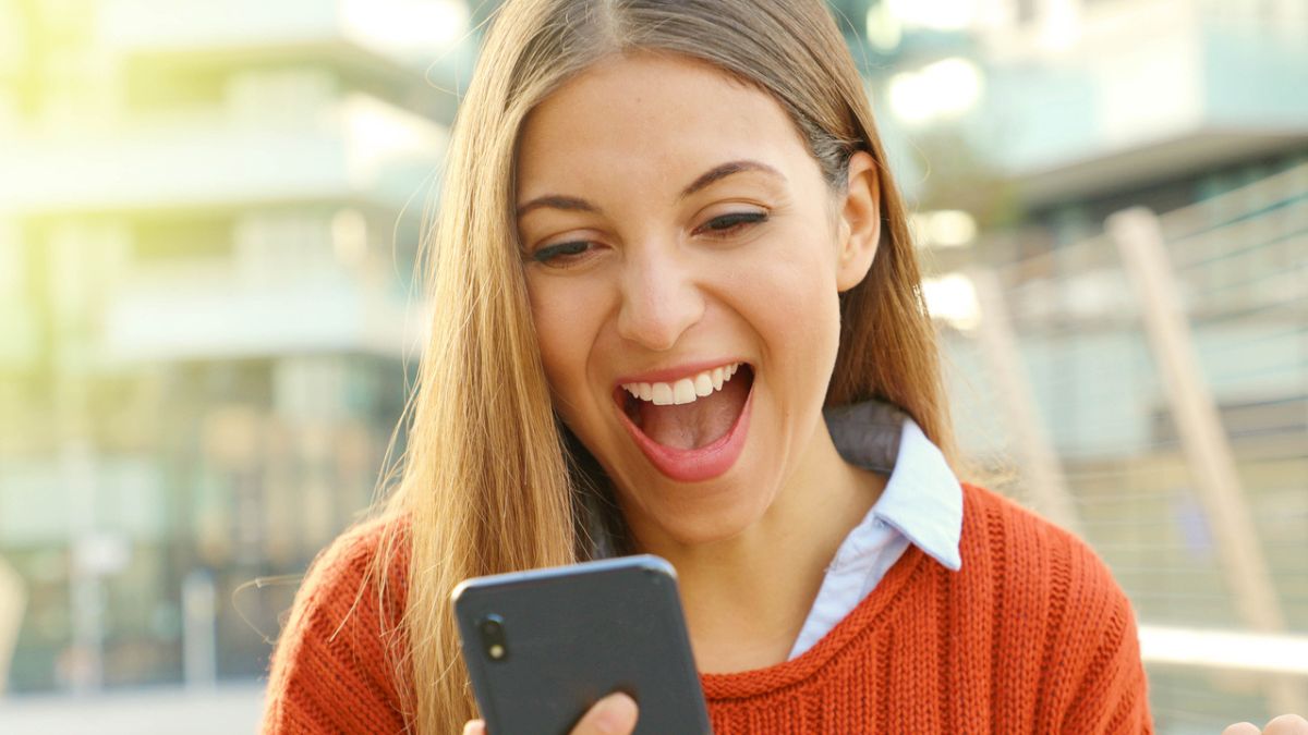 woman excited over a phone