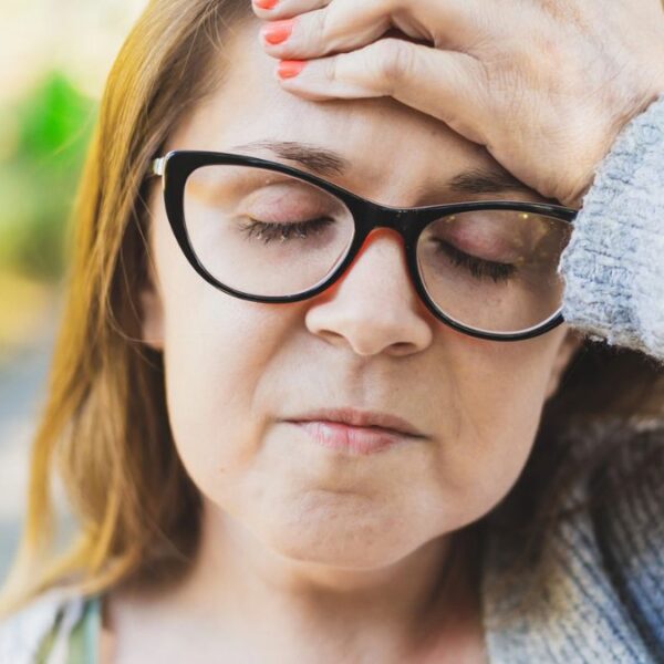 woman glasses outside worried