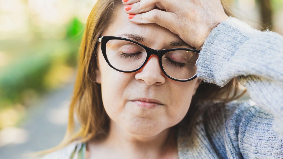 woman glasses outside worried