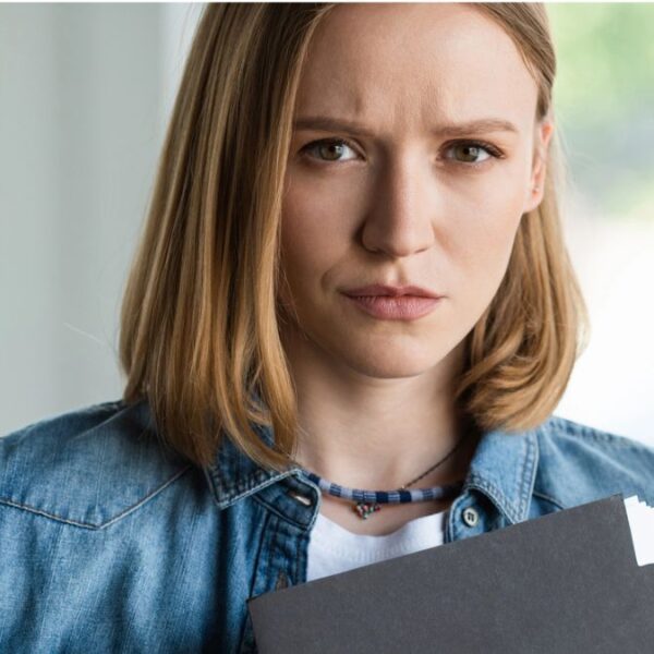 woman holding a clip board