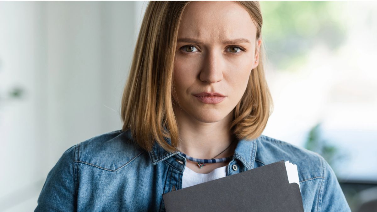 woman holding a clip board