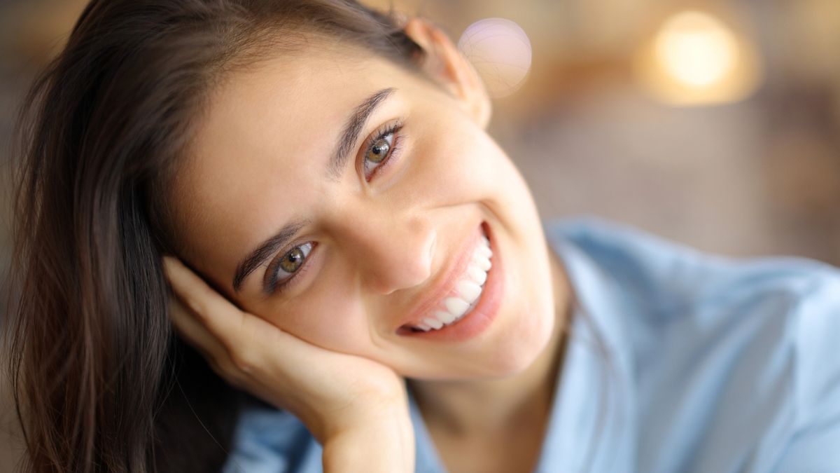 woman leaning with a smile