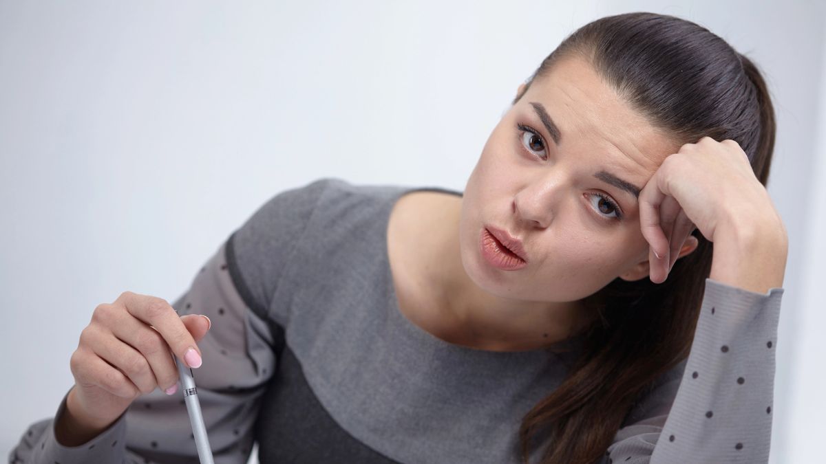 woman looking at her finances stuck