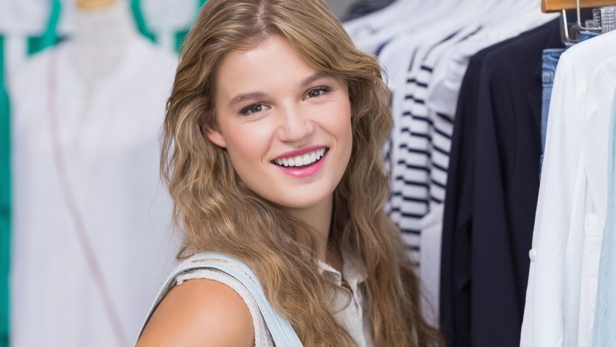 woman next to clothes shopping