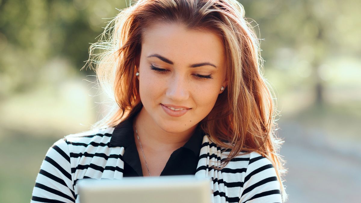 woman reading a tablet
