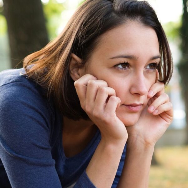 woman sad on a bench