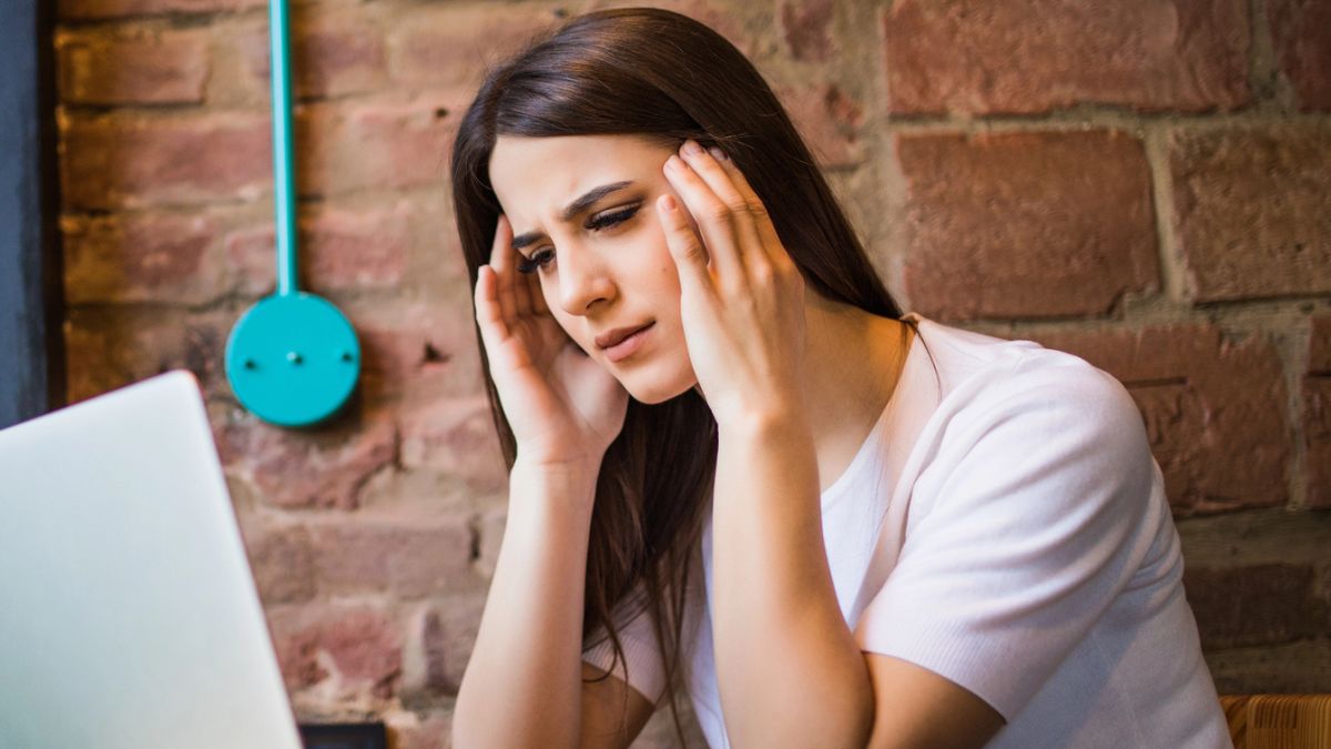 woman sad sitting a table