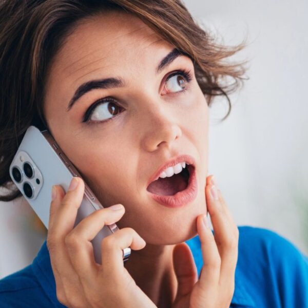 woman shocked on the phone