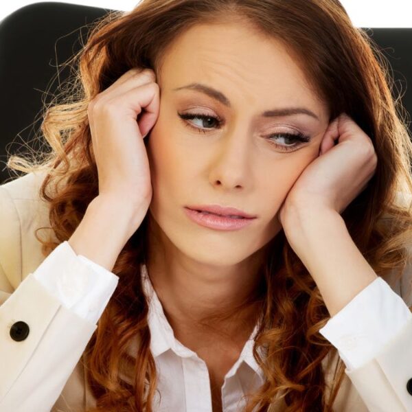 woman sitting with binders