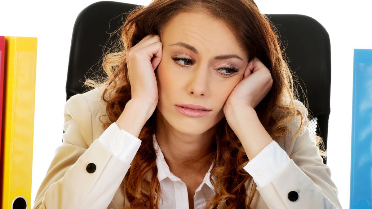 woman sitting with binders