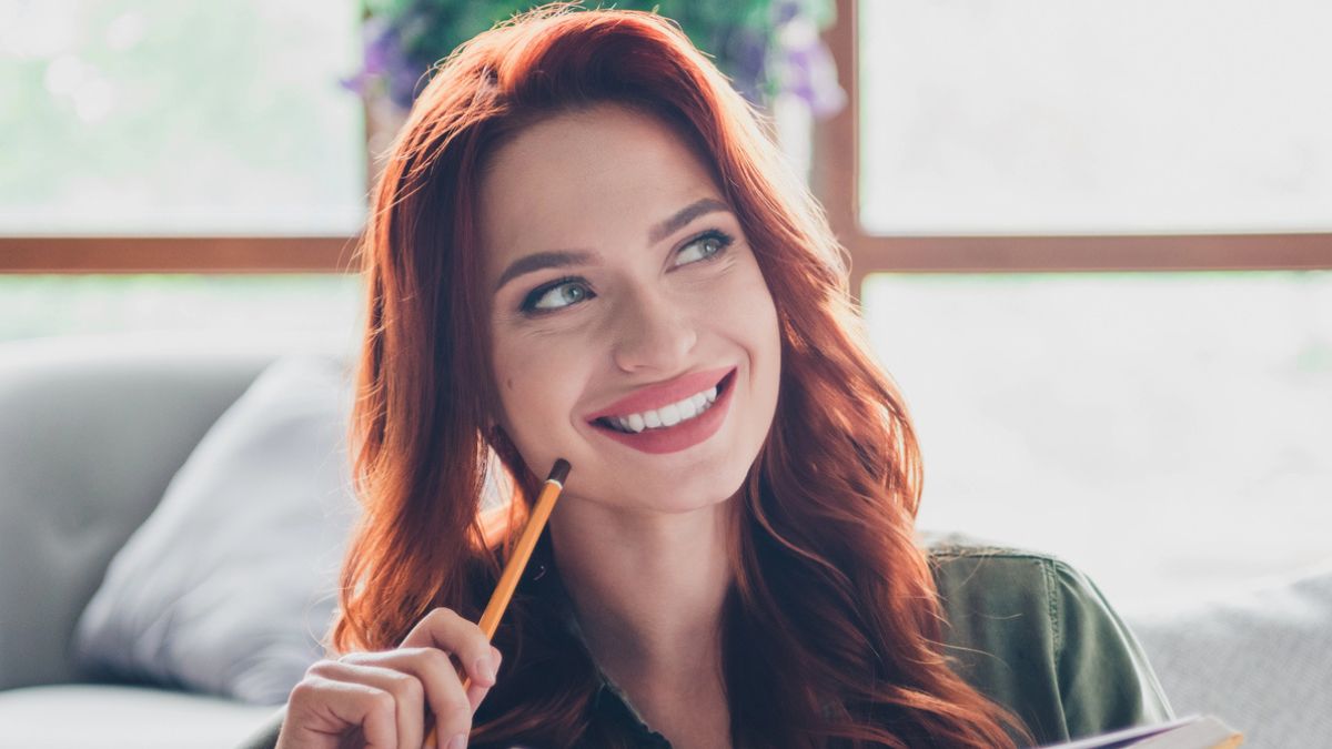 woman smiling on the couch