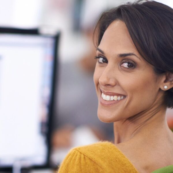 woman smiling over the shoulder