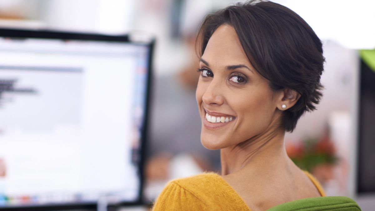 woman smiling over the shoulder