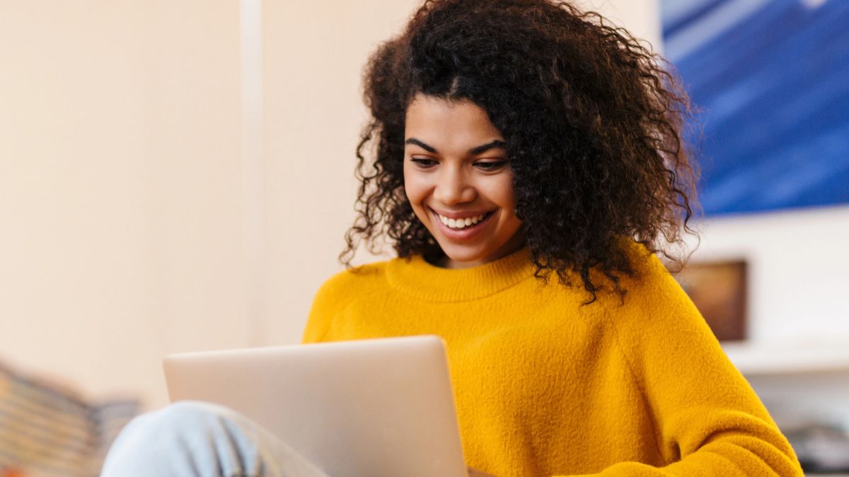 woman smiling with laptop (1)