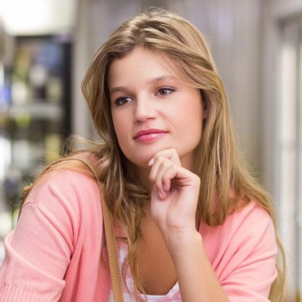 woman thinking in the grocery line