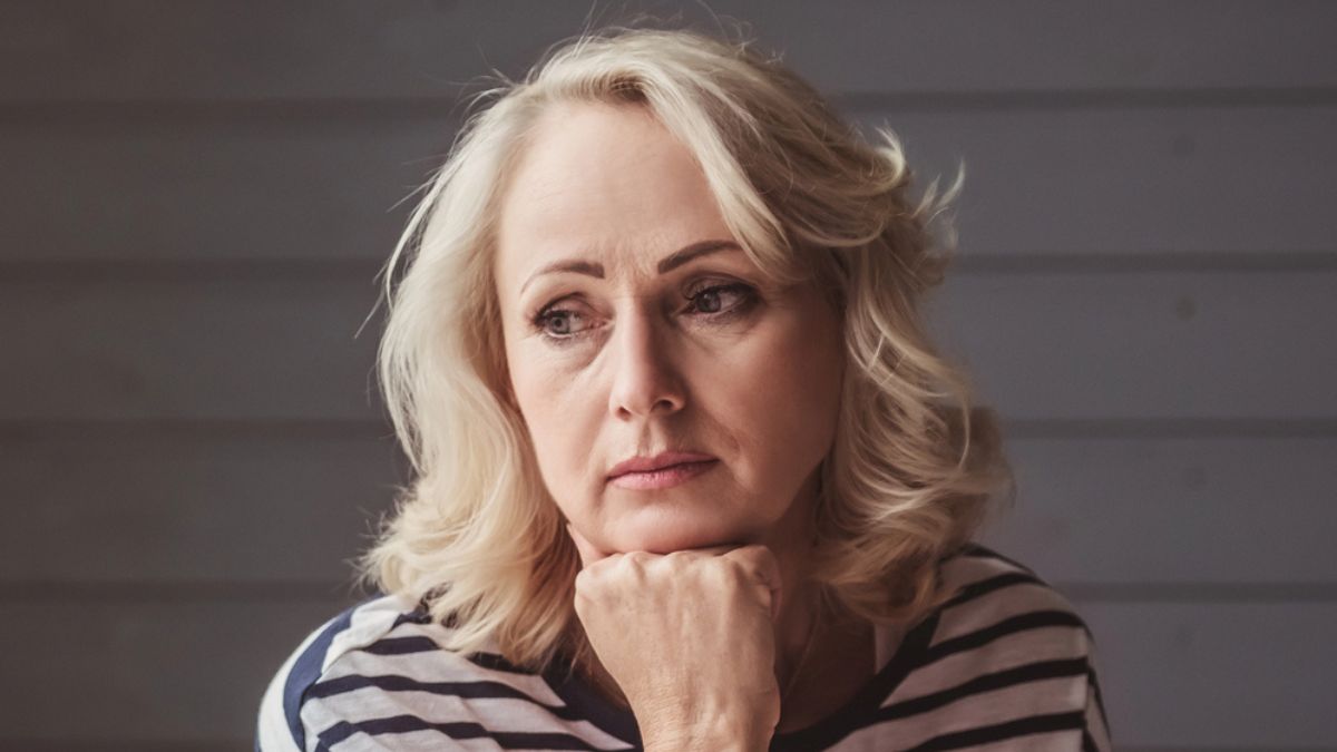 woman thinking to herself mature