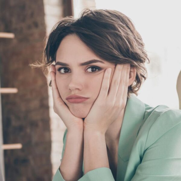 woman tired sitting at a desk