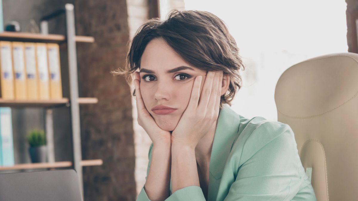 woman tired sitting at a desk