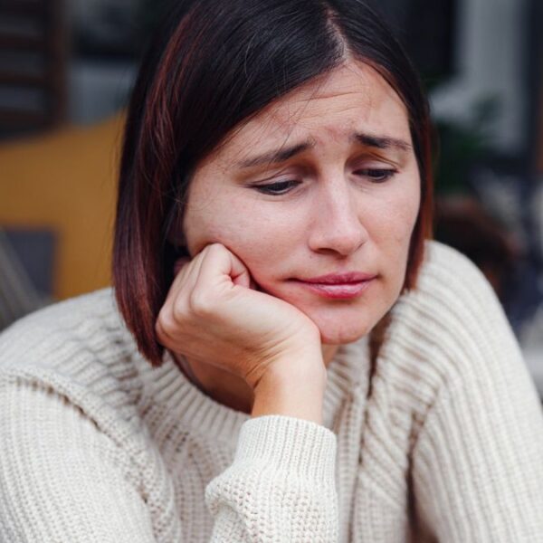 woman upset sitting alone