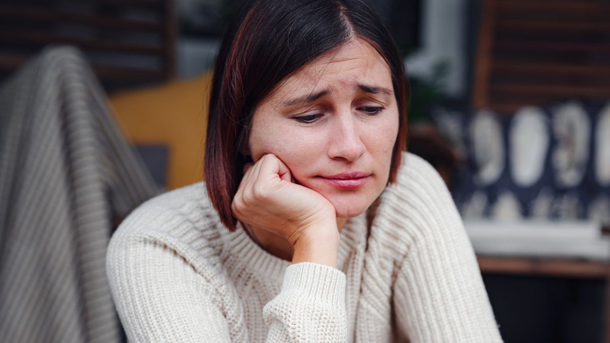 woman upset sitting alone