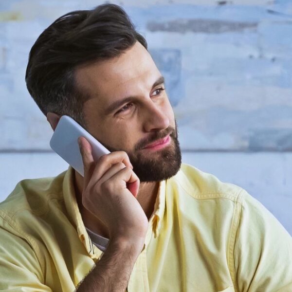 bearded man on the phone