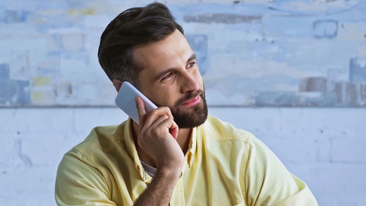 bearded man on the phone