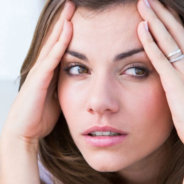 brunette headache at work
