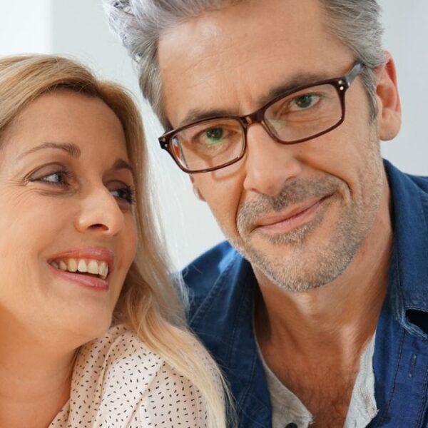 couple smiling with glasses