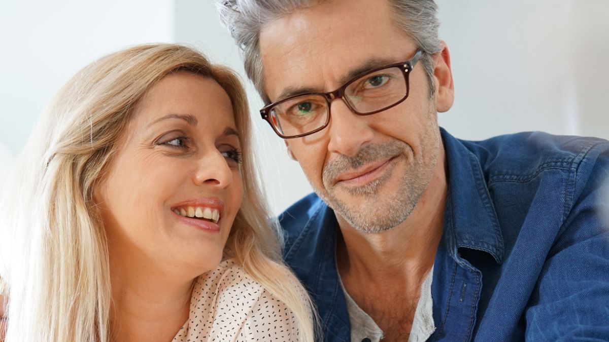 couple smiling with glasses