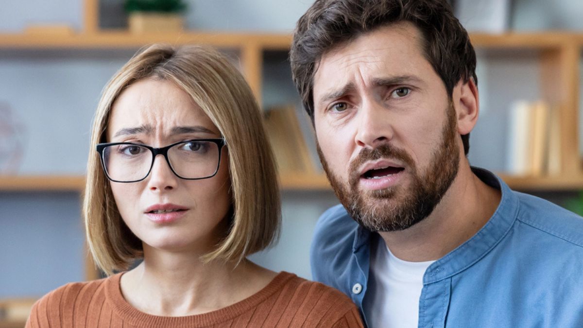 couple stunned at home worried