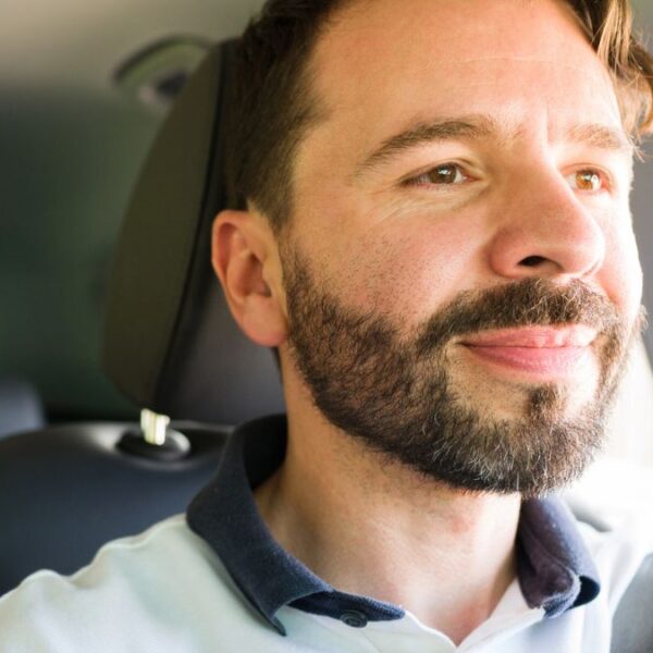 man driving a car