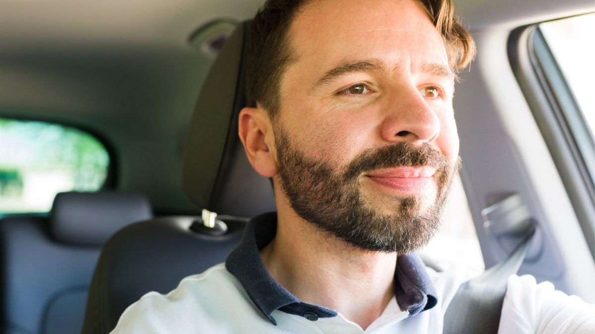 man driving a car